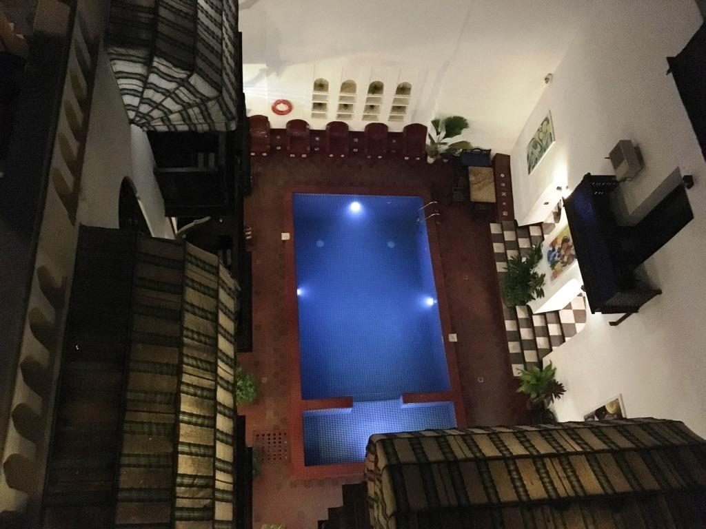 Dhow Palace swimming pool at night